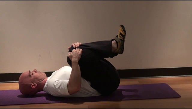 10. Supine Knee Hug + Hip Extension