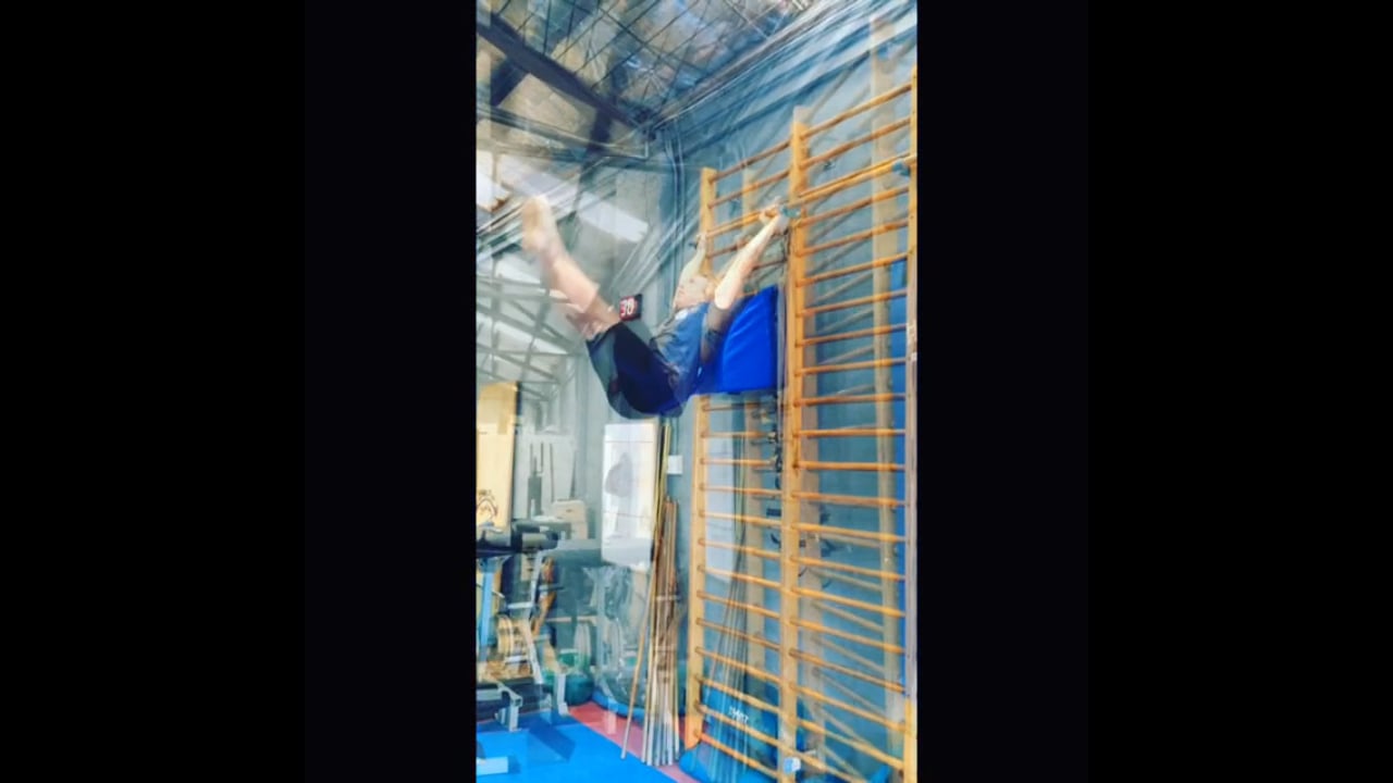 Vertical Knee Rise and Hanging Leg Rise off Stall Bars with the Shoulder Pad Coach Aid developing greater Range of Motion