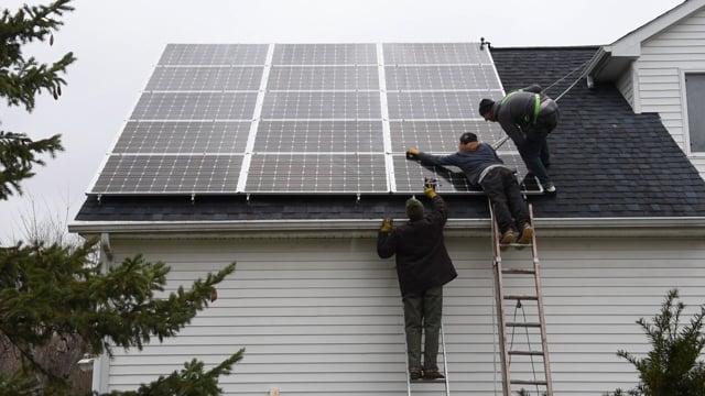Starting out in the cold, gray rain, then finishing up under a bright, sunny sky, Joe Nagle, Connor Lark and Will Held— from Strawberry Solar — installed solar panels on our garage roof.