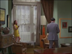 video - It sounds like rain, so Steed gallantly offers Emma his much-shrunken umbrella and turns up the collar of his suit