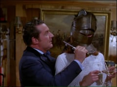 video - Emma laughs out loud when Steed ends up stuck in the knight’s helmet