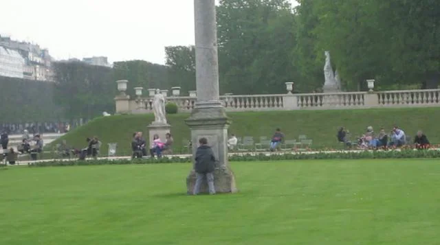 Kid Peeing in Paris Park  