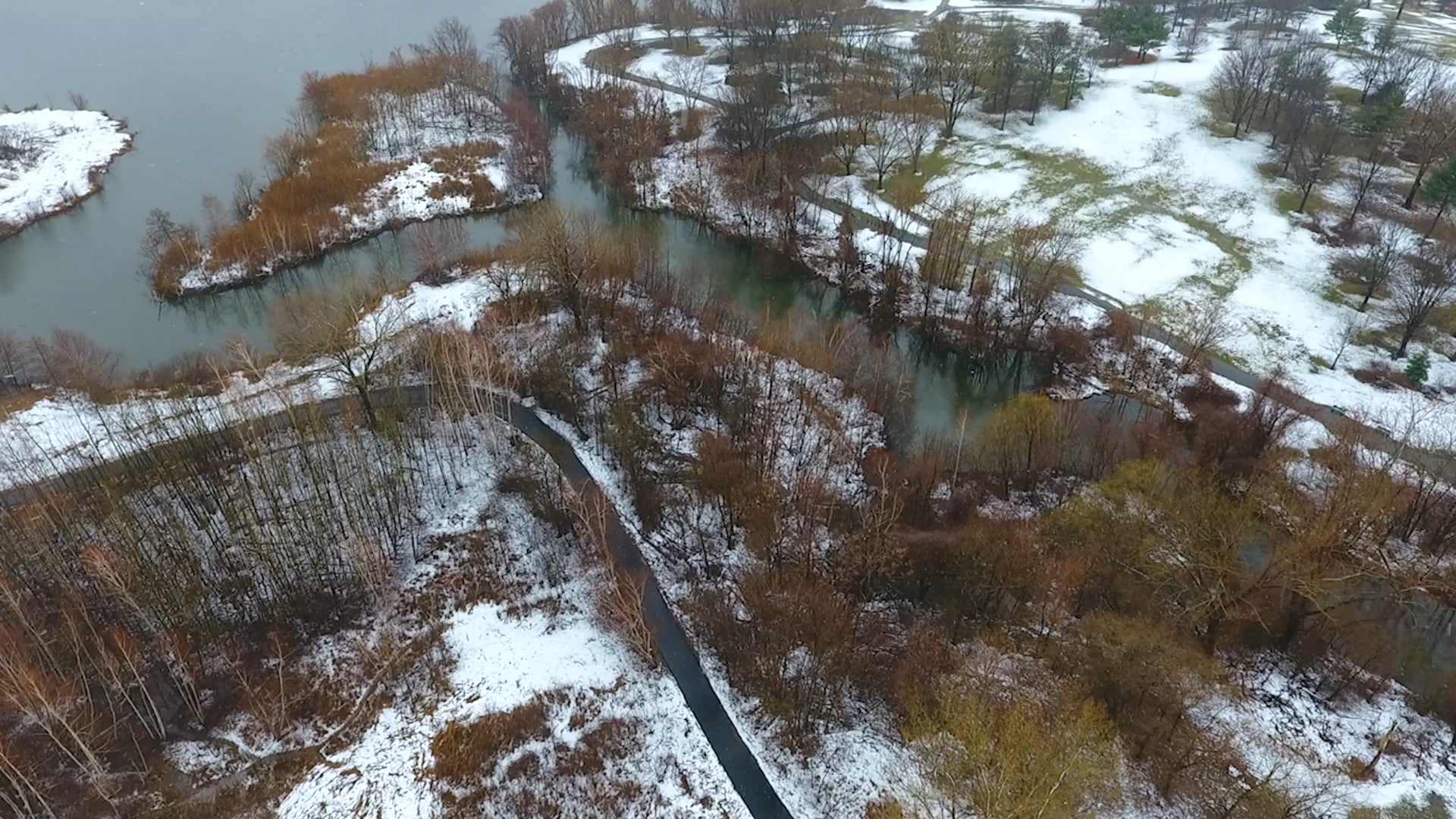 AERIAL: PARK WITH LITE SNOW