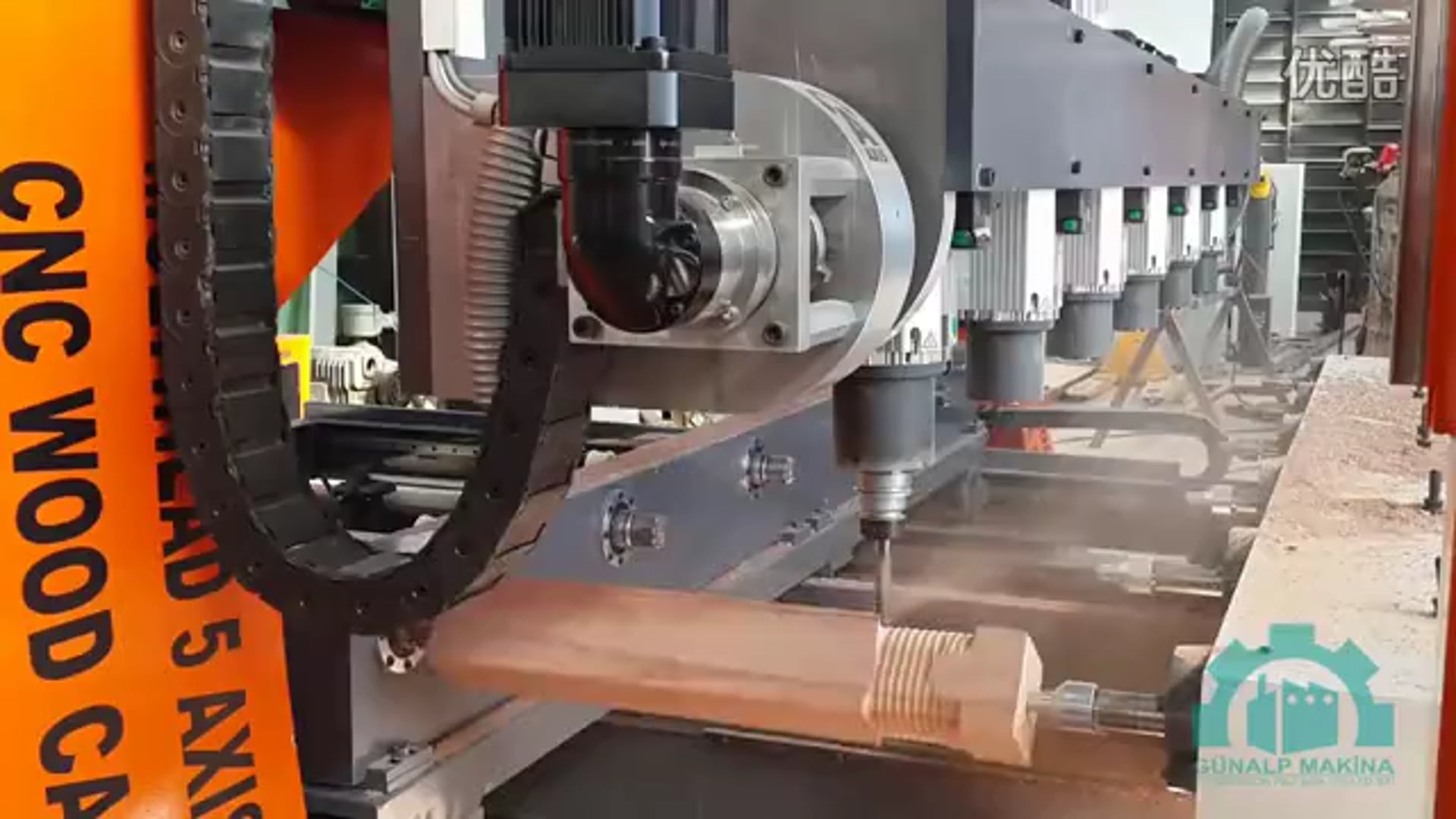 A CNC Router Waving its 5 Axis Simultaneously on a Wood