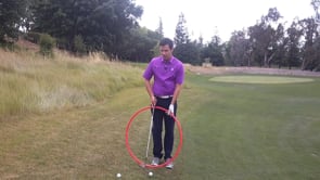 Chipping from a downhill lie