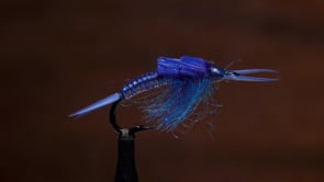 A fly vise holding a undefined after it is tied