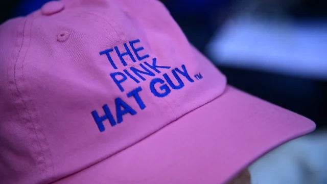 Pink hat guy hot sale at wrigley field