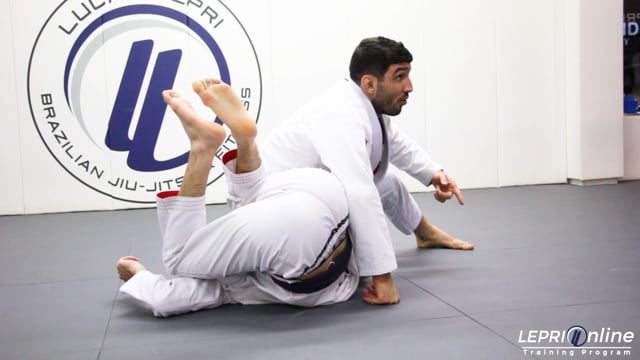 Guard Pull to Omoplata when an Opponent Defends by Rolling