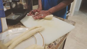 my mother kneads dough for Christmas bread