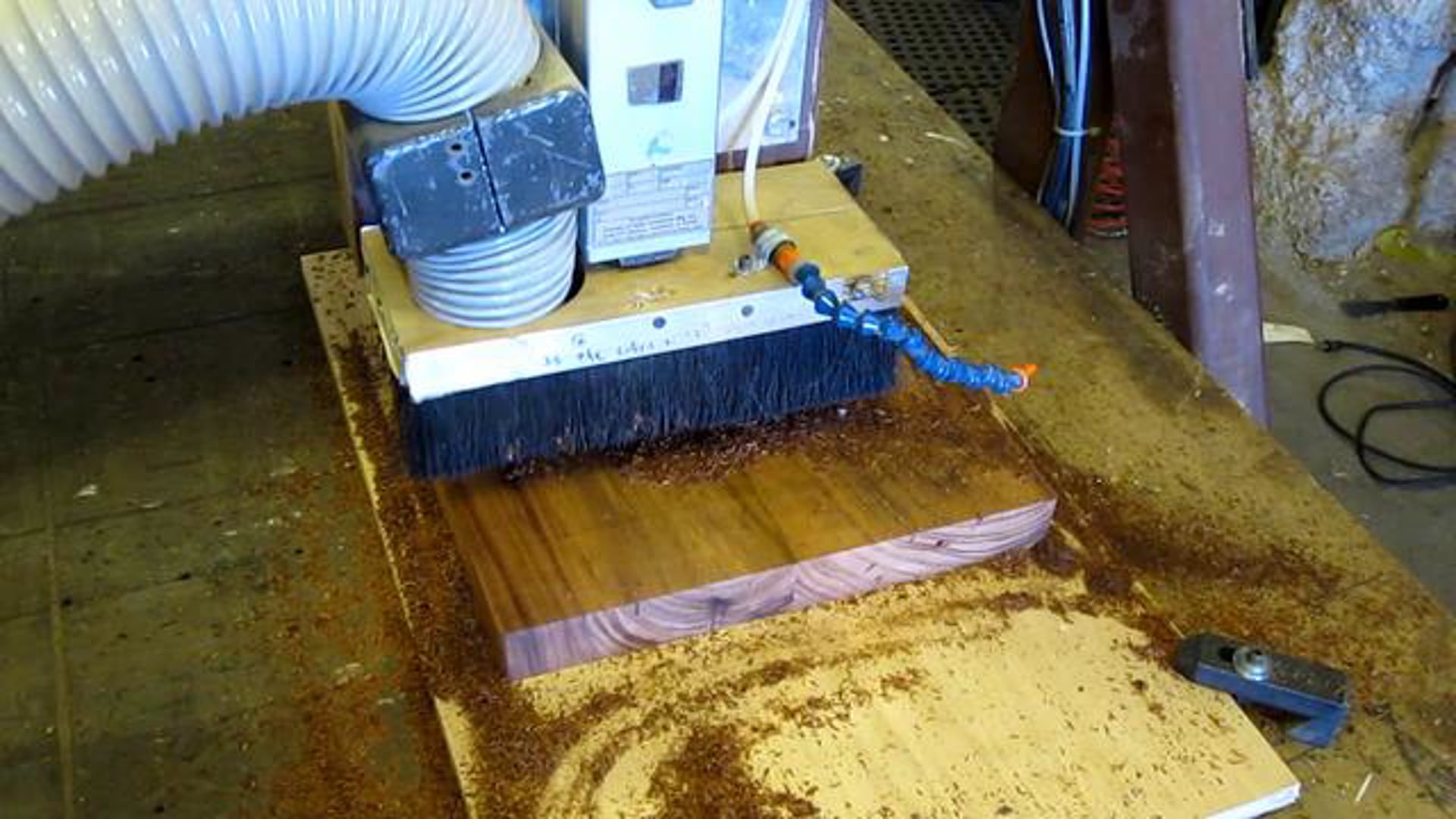 CNC router attacking afromosia wood chair seat