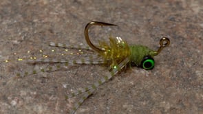 A fly vise holding a undefined after it is tied