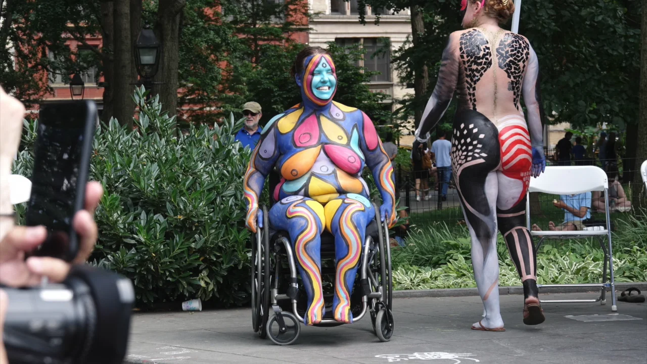 NAKED BODY PAINTED PEOPLE SINGS.....