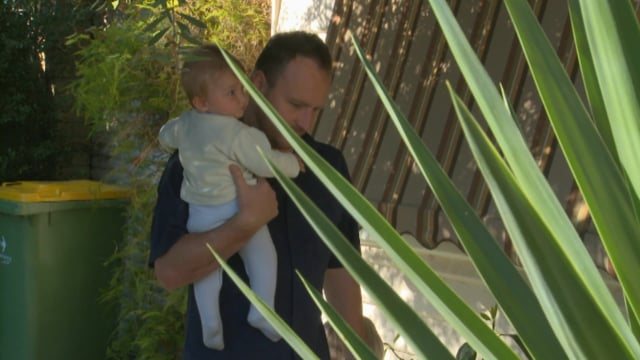 How to pick up and hold a baby safely