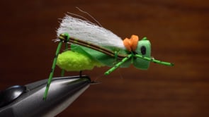A fly vise holding a undefined after it is tied