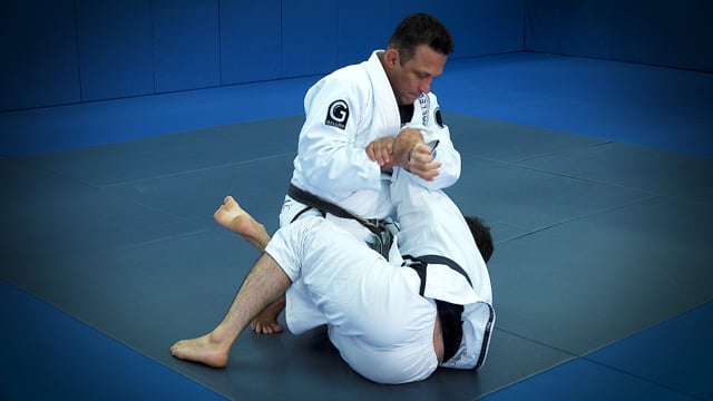 Renzo Gracie on top, teaching a position on the mat