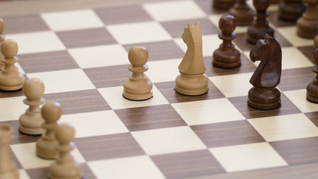 Close Up Of Chess Board Pieces With Player Hand Moving Chess Piece Creating  Shadow Free Stock Video Footage Download Clips Education