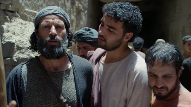 Jesus talking with man in city