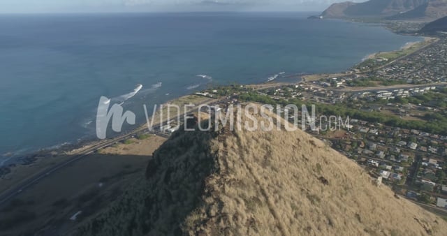 Drone Circling Around Woman Standing On Mountain Ridge