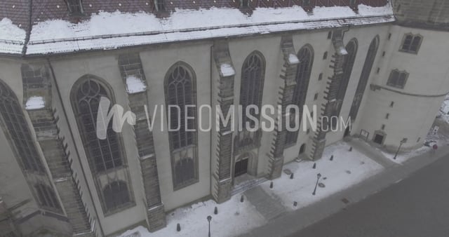 Drone Descending Near Cathedral Wall