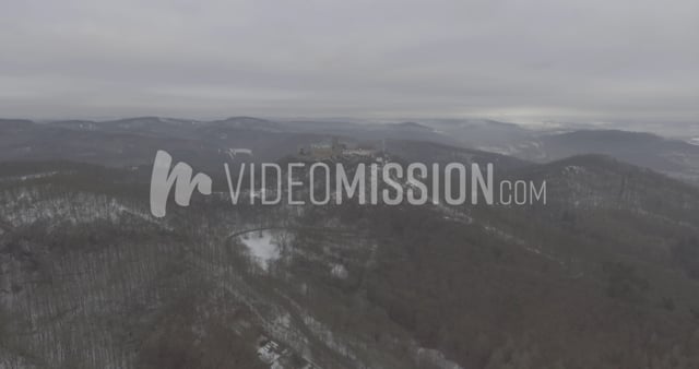 Drone Flying Away From Castle In Winter