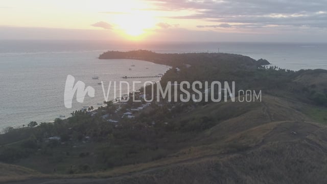 Drone Flying Away From Island Hills Sunrise