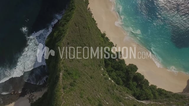 Drone Flying Over Mountain Ridge Near Coast