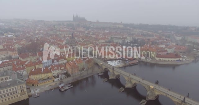 Drone Rising Above European River With City View
