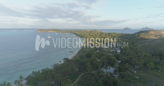 Drone Slowly Descending Over Bay With Fishing Boats