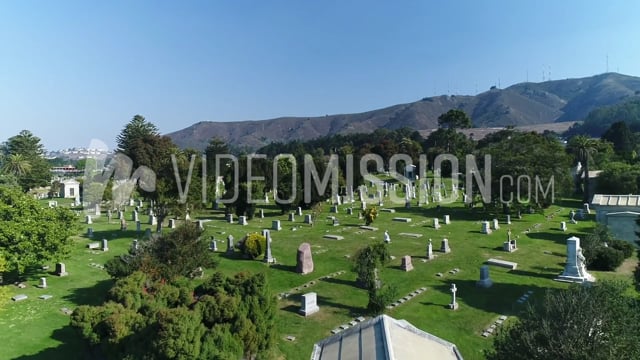 Drone Flying Over California Graveyard Toward Hills