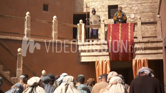 King Prays Toward Heaven Above Crowd