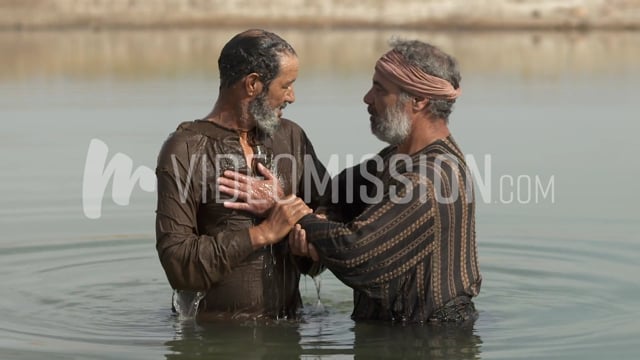 Man Is Baptized In A River