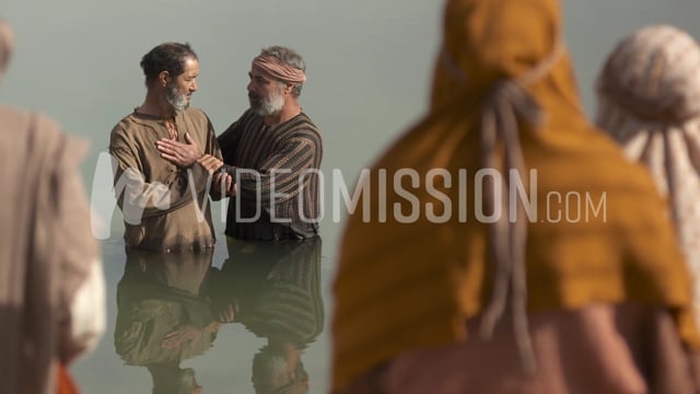 Man Is Baptized In The River Crowd Looks On