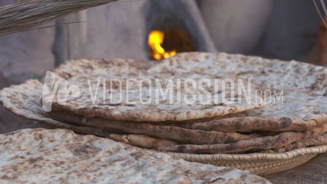 Woman Fanning Flat Bread Close Up