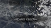 Satellite image of cirrus clouds. A gray box toward the top left has text that reads "2002 NASA Image, Rhone Valley, Eastern France." Text appears toward the bottom.