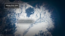 Satellite image of the Selenga River Delta. A gray box in the top left corner has text that reads "Selenga River Delta, Lake Baikal, Russia." Text toward the center left reads "Freshwater is critical to life."