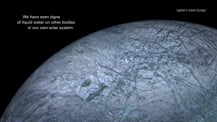 Image of Europa. Text in the top right corner reads "Jupiter's moon Europa." Text toward the top left reads "We have seen signs of liquid water on other  bodies in our own solar system."