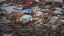 Image of devastation from a tsunami in 2004. Text appears in the bottom left.