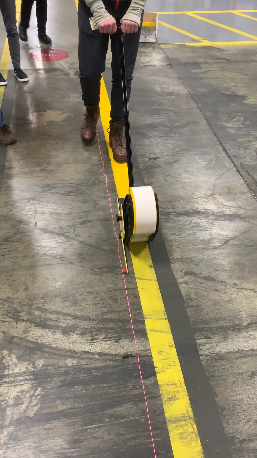 Demonstration of the New Mighty Liner Floor Tape Applicator In