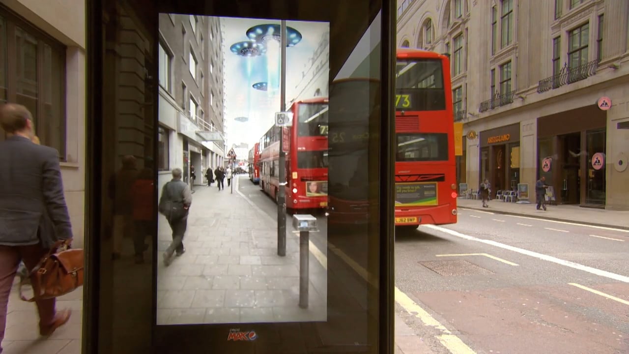 People reacting to AR at bus shelter