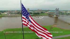 086 Cool drone ascent American-flag to Alexandria downtown skyline 3