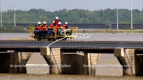 1333 Army corps of engineers workers ride on bonne carre