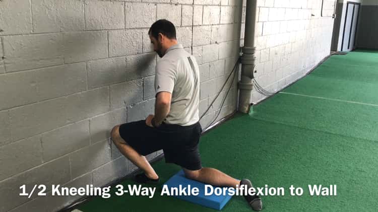 1/2 Kneeling 3-Way Ankle Dorsiflexion to Wall on Vimeo