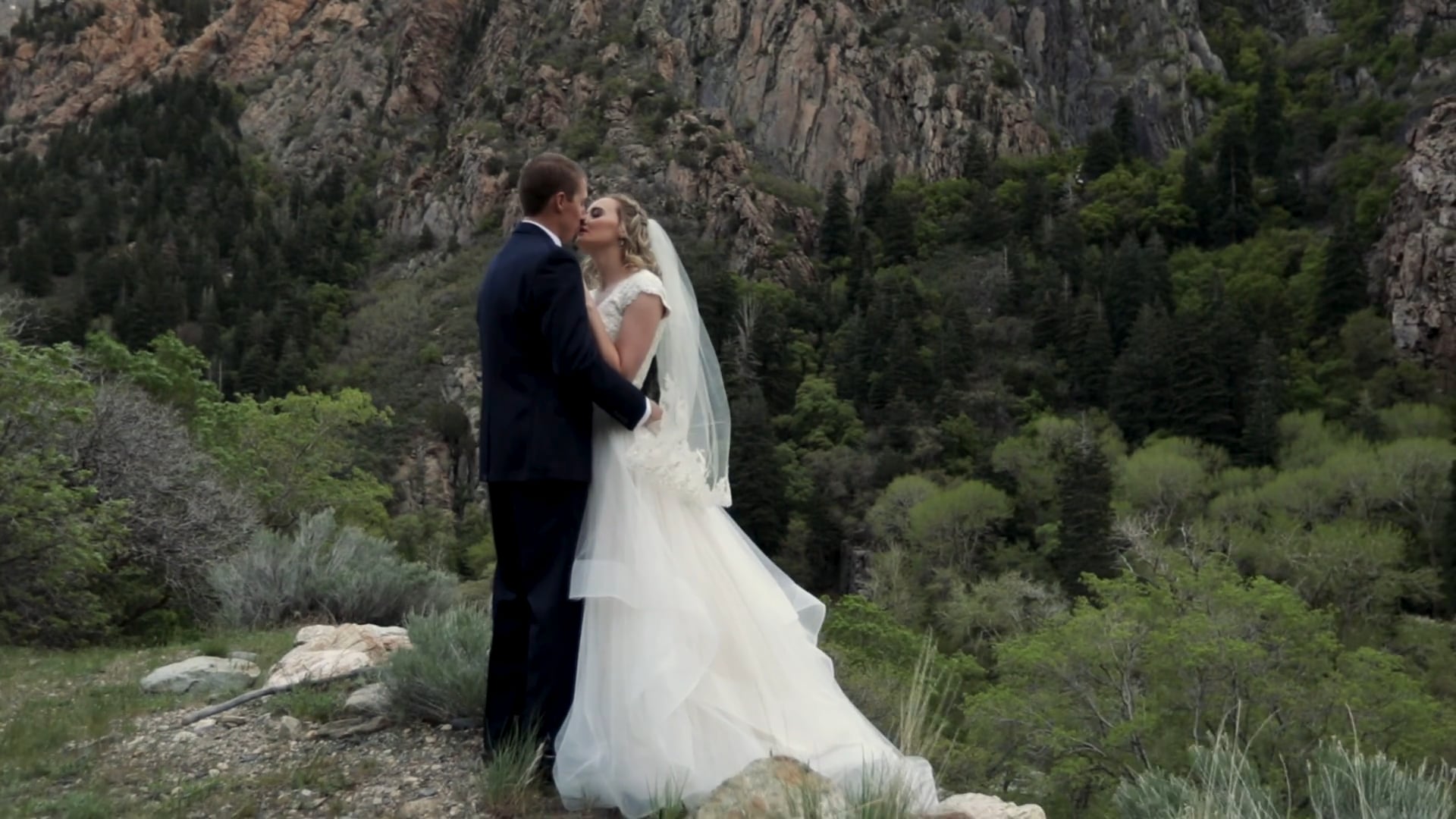 Kelton + Katelyn First Look Film on the rocky cliffs of the Wasatch Mountains