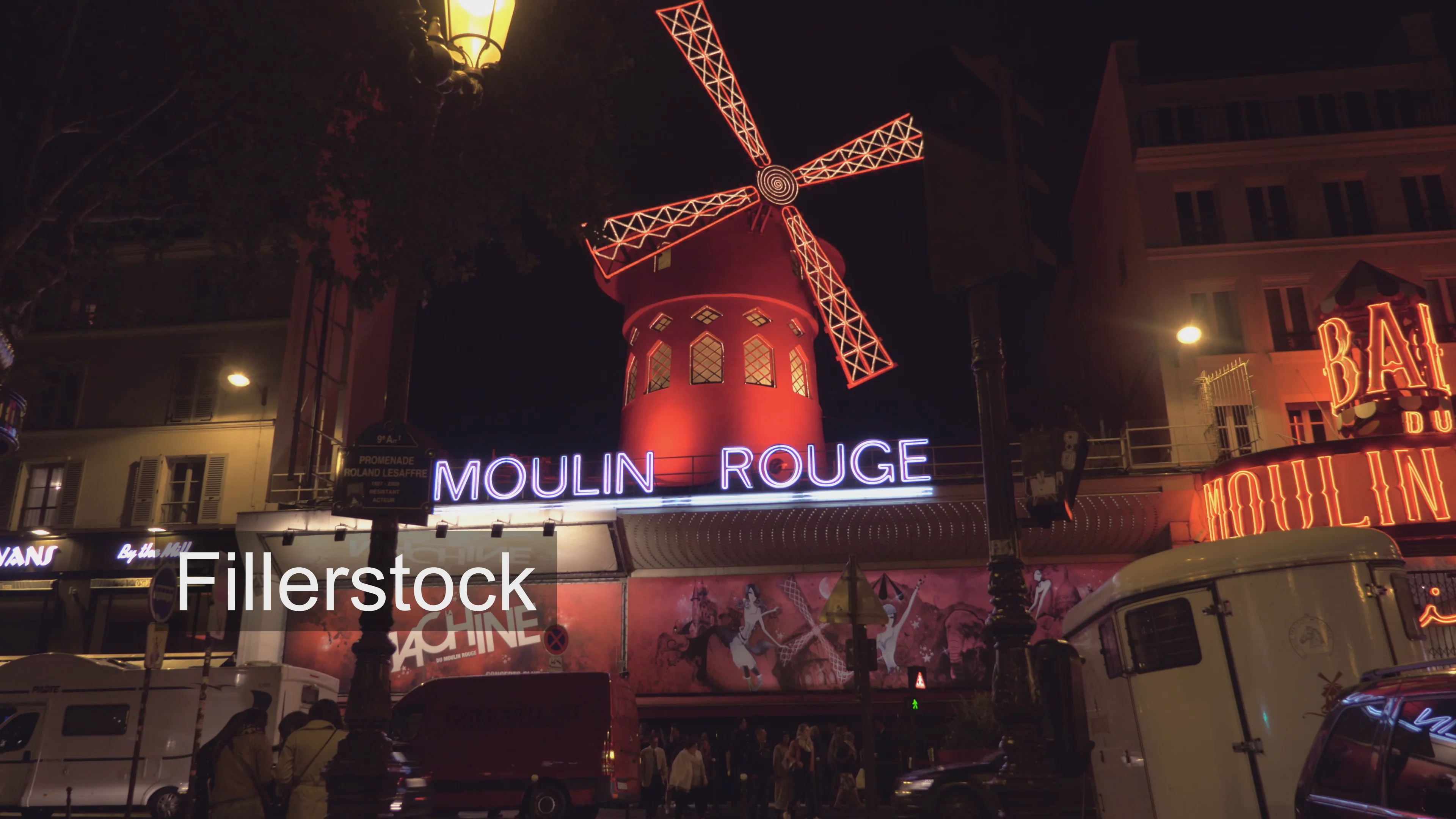 Night view of illuminated Moulin Rouge in Paris, France on Vimeo