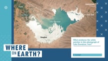 Against a blue background is a satellite image of a lake with labeled features. To the lower right of the image is a white box with text. Toward the bottom left corner is the "Where on Earth?" logo.