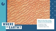 Against a blue background is a satellite image of sand dunes. To the lower right of the image is a white box with text. Toward the bottom left corner is the "Where on Earth?" logo.