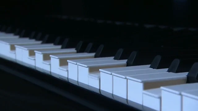 Piano that plays deals itself