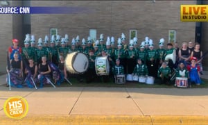 High School Football Team Unites with Rival Marching Band