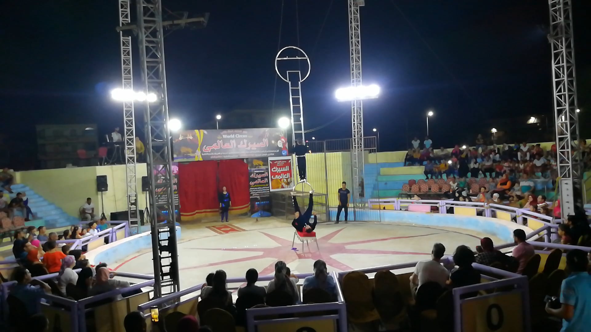 Circus Strong Guy Ladder Show With Golden Boy