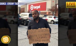Man Makes Sign for Help While Wife Shops in Target